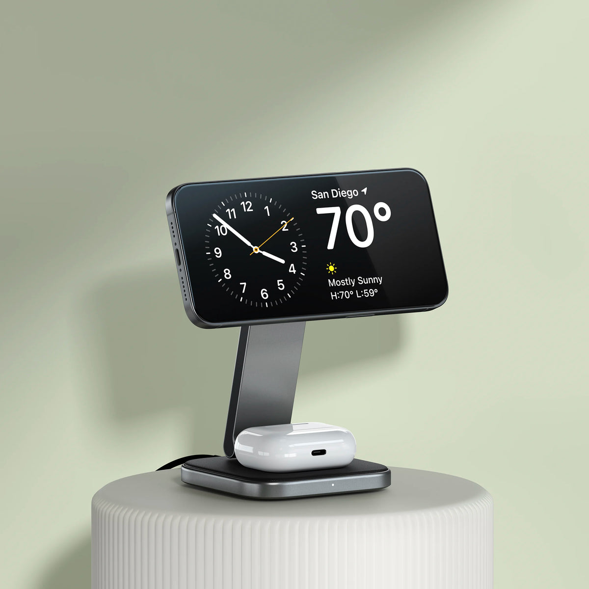 2-in-1 Foldable Qi2 Wireless Charging Stand with an iPhone in StandBy mode and AirPods