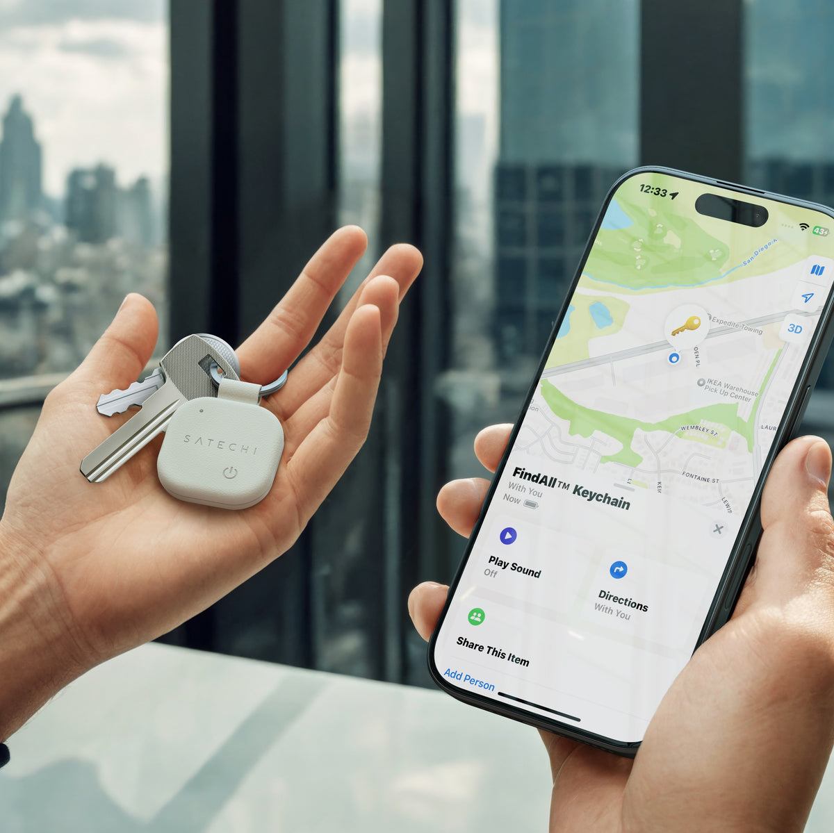 Hand holding keys with a Satechi Vegan-Leather FindAll Keychain in Sand, next to an iPhone showing it in the Find My app