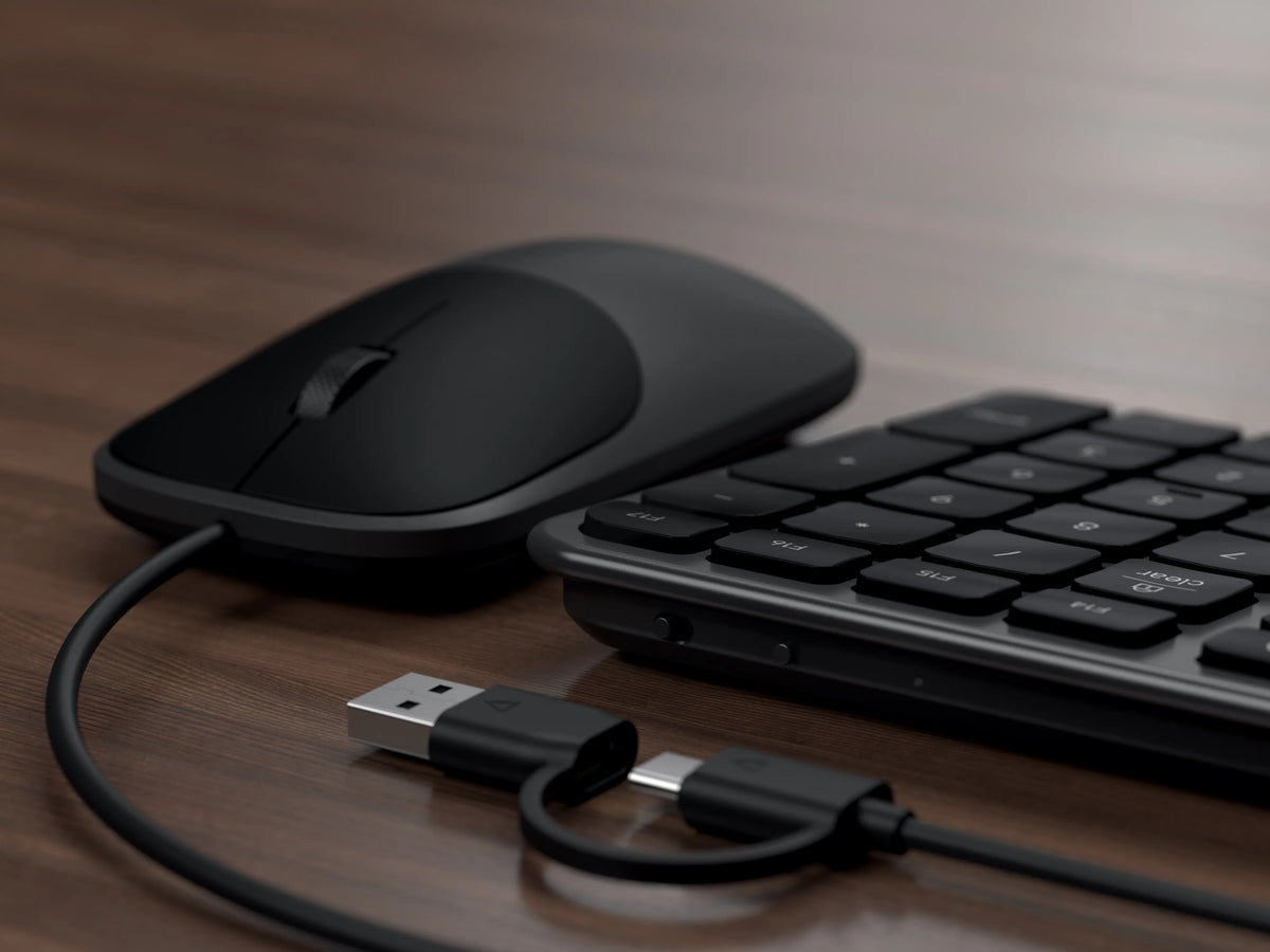 Slim CLX3 Wired Combo mouse in Space Black with its USB-C cable and USB-A adapter