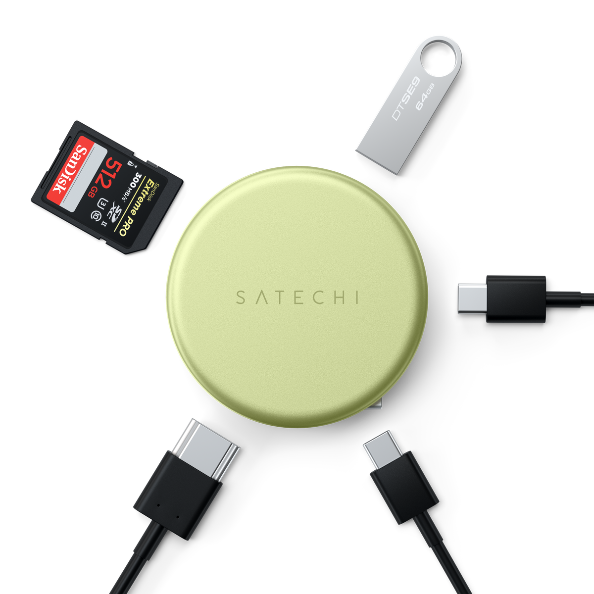 A OntheGo™ 5-in-1 Multiport Adapter in Cirtus with a SanDisk 128GB SD card, a silver USB flash drive, and four black USB-C cables arranged around it.