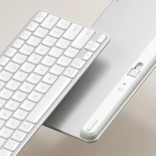 Satechi Slim EX1 Wireless Keyboard in white, angled to show its keys and the underside compartment that stores a USB-C receiver.