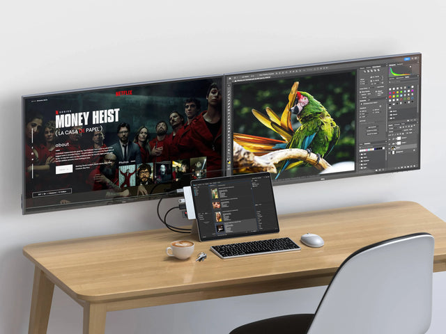 Satechi Dual USB-C Hub attached to a Microsoft Surface Pro on a desk, connected to two monitors, with a keyboard, mouse and coffee cup.
