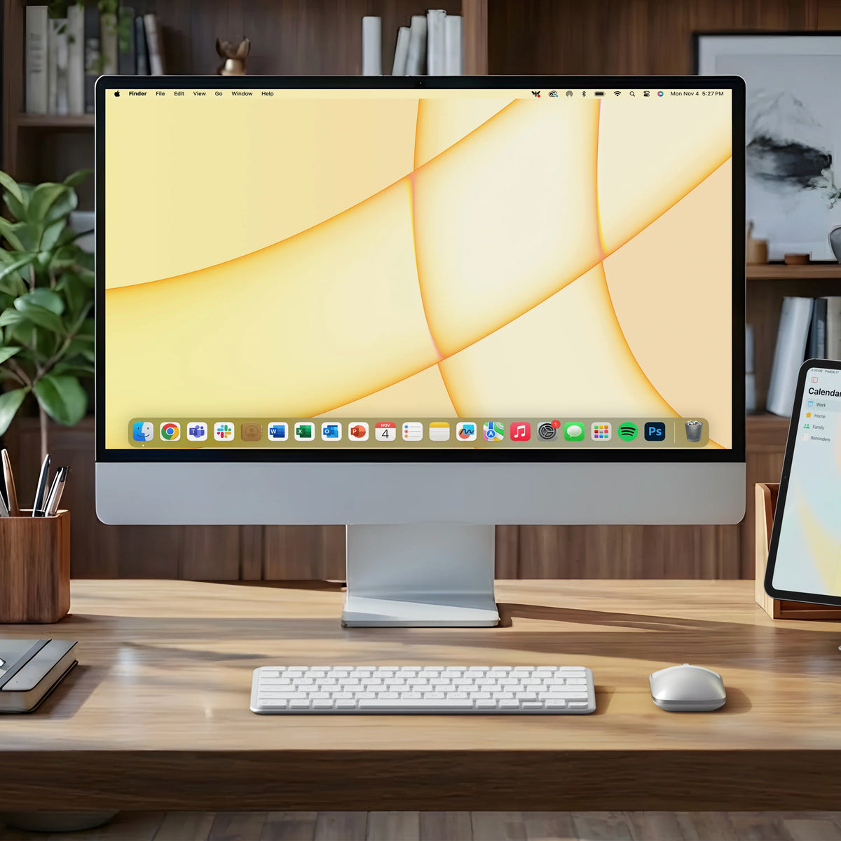 Satechi Slim EX1 Wireless Keyboard and matching mouse in Silver on a desk in front of an iMac