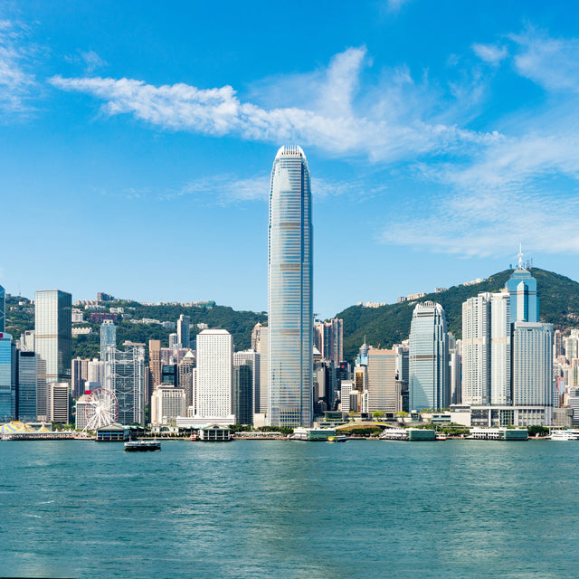 Hong Kong skyline across Victoria Harbour on a clear day.
