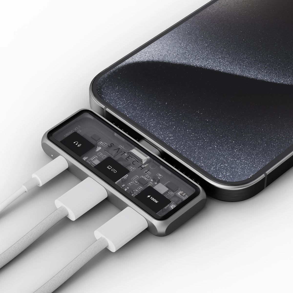 Mobile XR Hub with Audio plugged into an iPhone, with three white cables connected