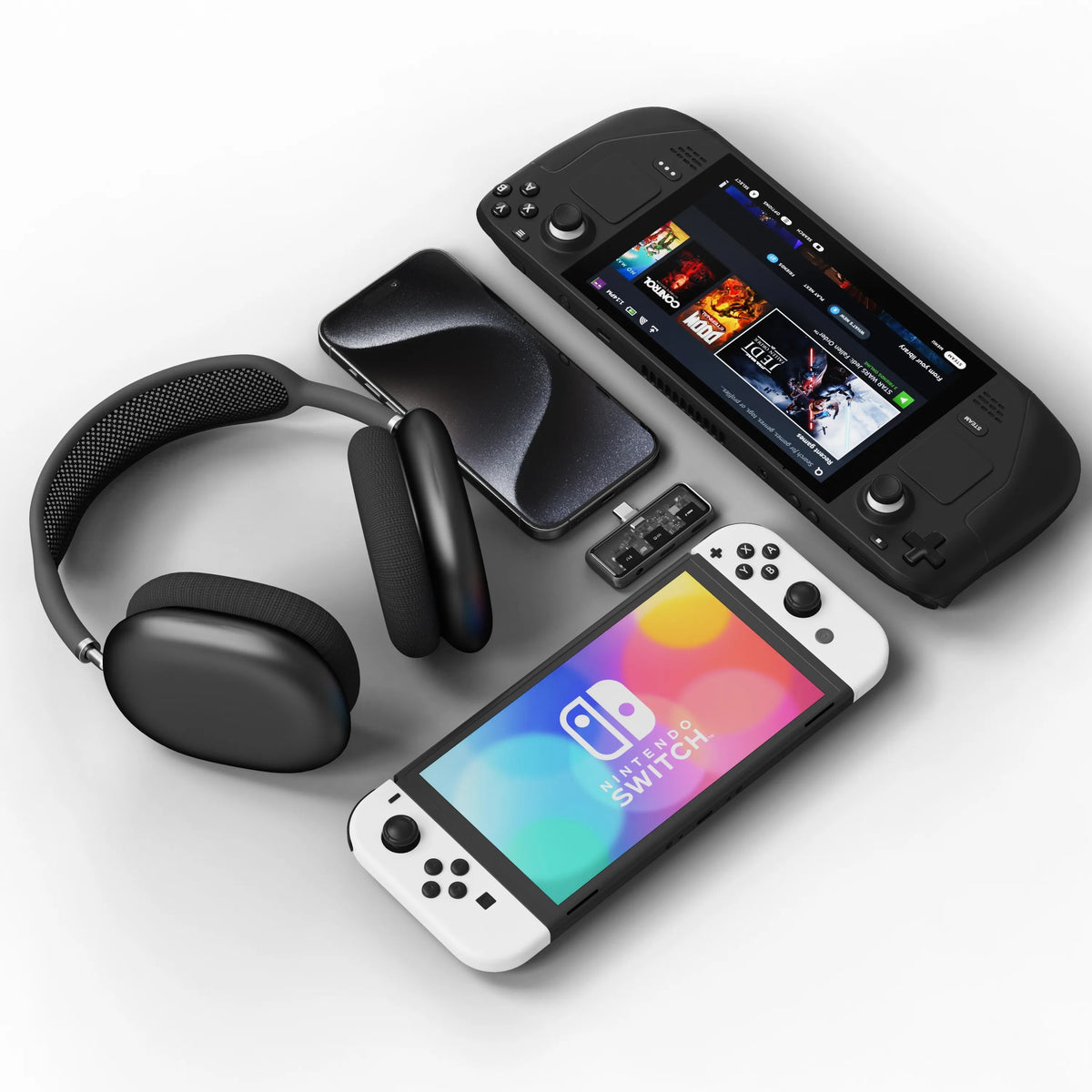 Mobile XR Hub with Audio shown with compatible devices: over-ear headphones, an iPhone, a Steam Deck and a Nintendo Switch