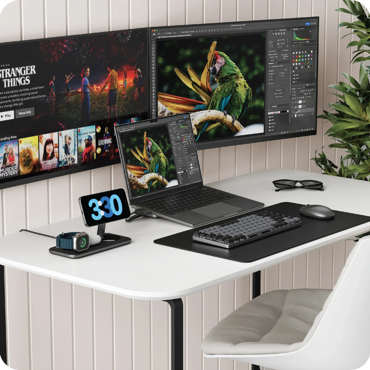 Qi2 Trio Wireless Charging Pad on a white desk with two monitors, laptop and keyboard