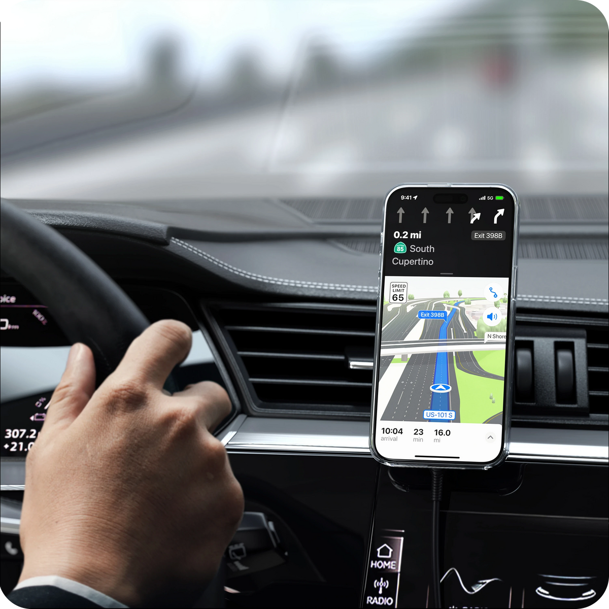 Qi2 Wireless Car Charger holding an iPhone showing navigation on a car dashboard