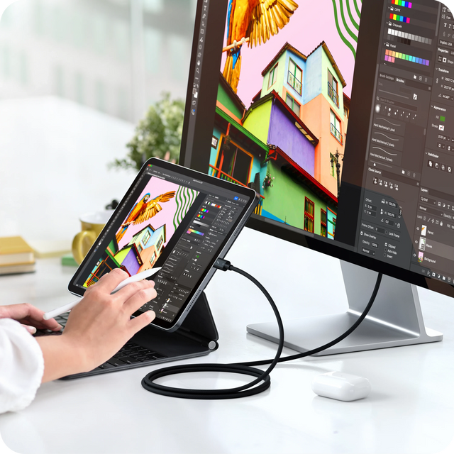 Satechi Thunderbolt 5 Pro Cable connecting an iPad Pro running a photo editing app to an external monitor showing the same image, while a person draws with an Apple Pencil.