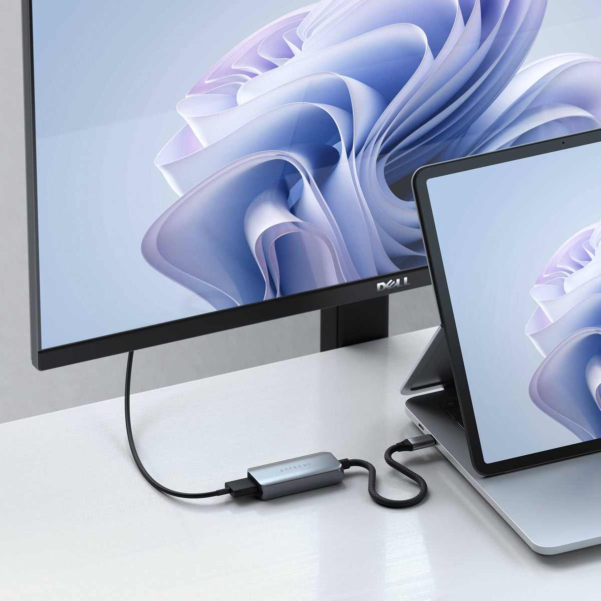 USB-C to HDMI 2.1 8K Adapter connecting a Surface laptop to a Dell monitor