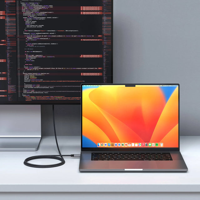 Satechi USB4 Pro Cable, 1.2m, connecting a MacBook Pro to an external monitor on a white desk.