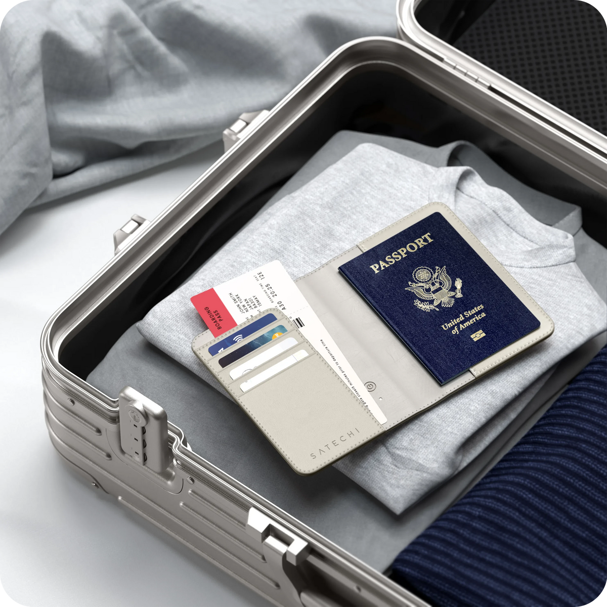 Vegan-Leather FindAll Passport Cover in Sand with a passport, packed in a suitcase