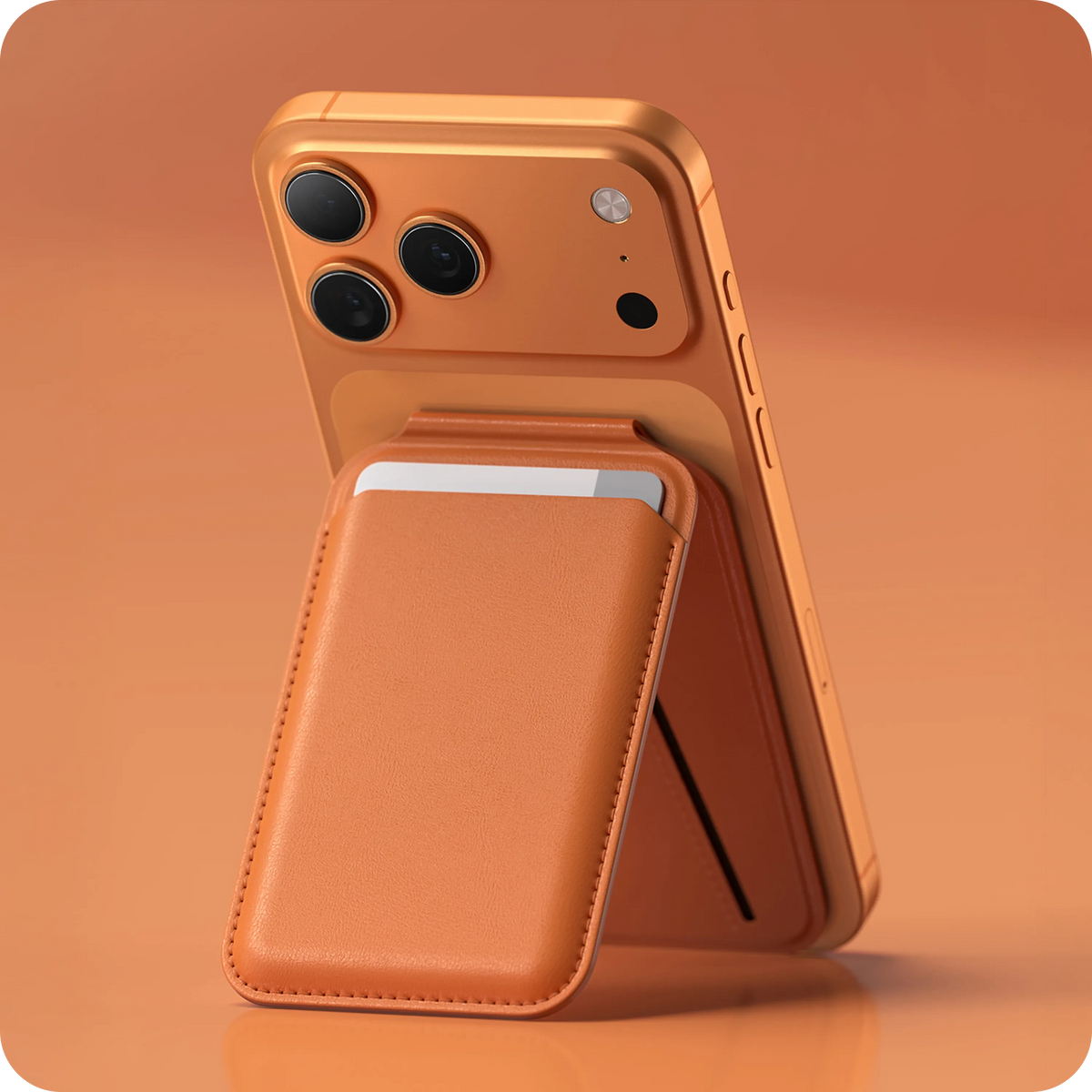 Vegan-Leather Magnetic Wallet Stand in Orange propping up an iPhone on an orange surface