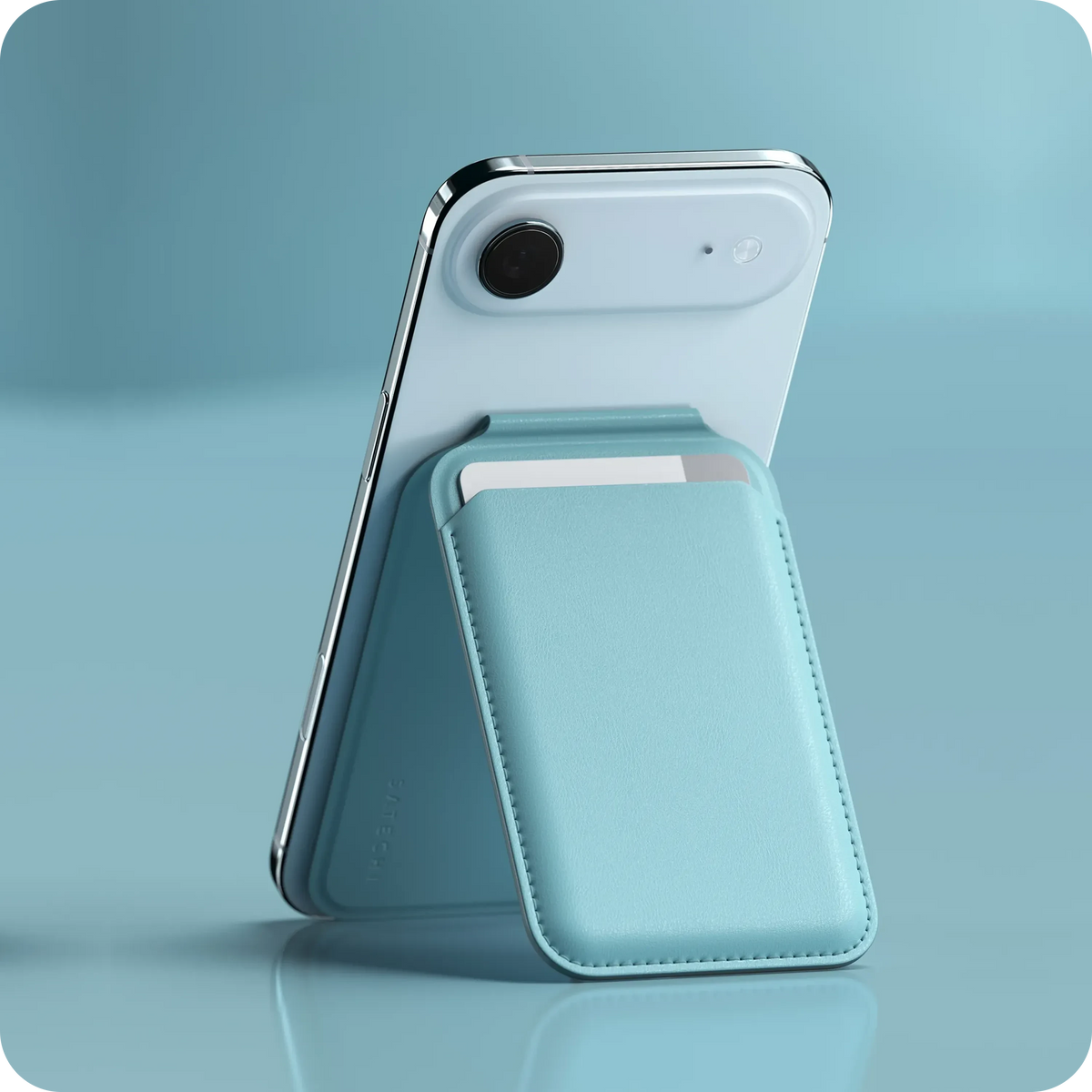 Vegan-Leather Magnetic Wallet Stand in Light Blue propping up an iPhone, close up