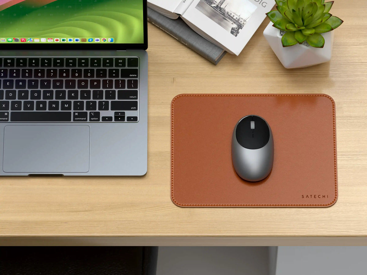 Vegan-Leather Premium Mouse Pad in Brown with a mouse on a wooden desk next to a laptop