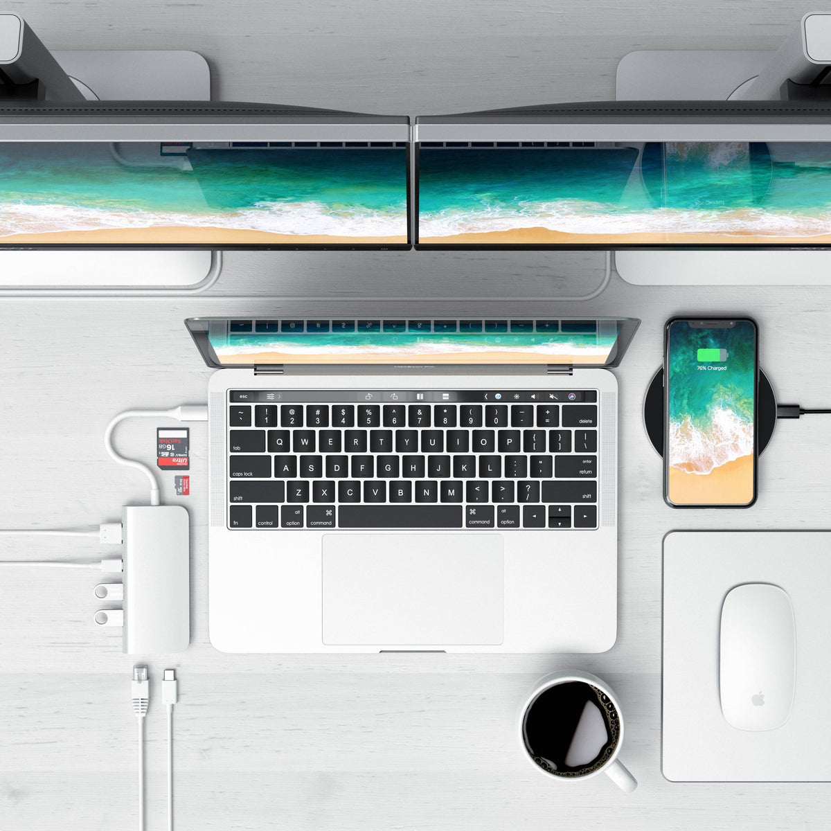 Type-C Multimedia Adapter in Silver connected to a MacBook on a white desk below two monitors