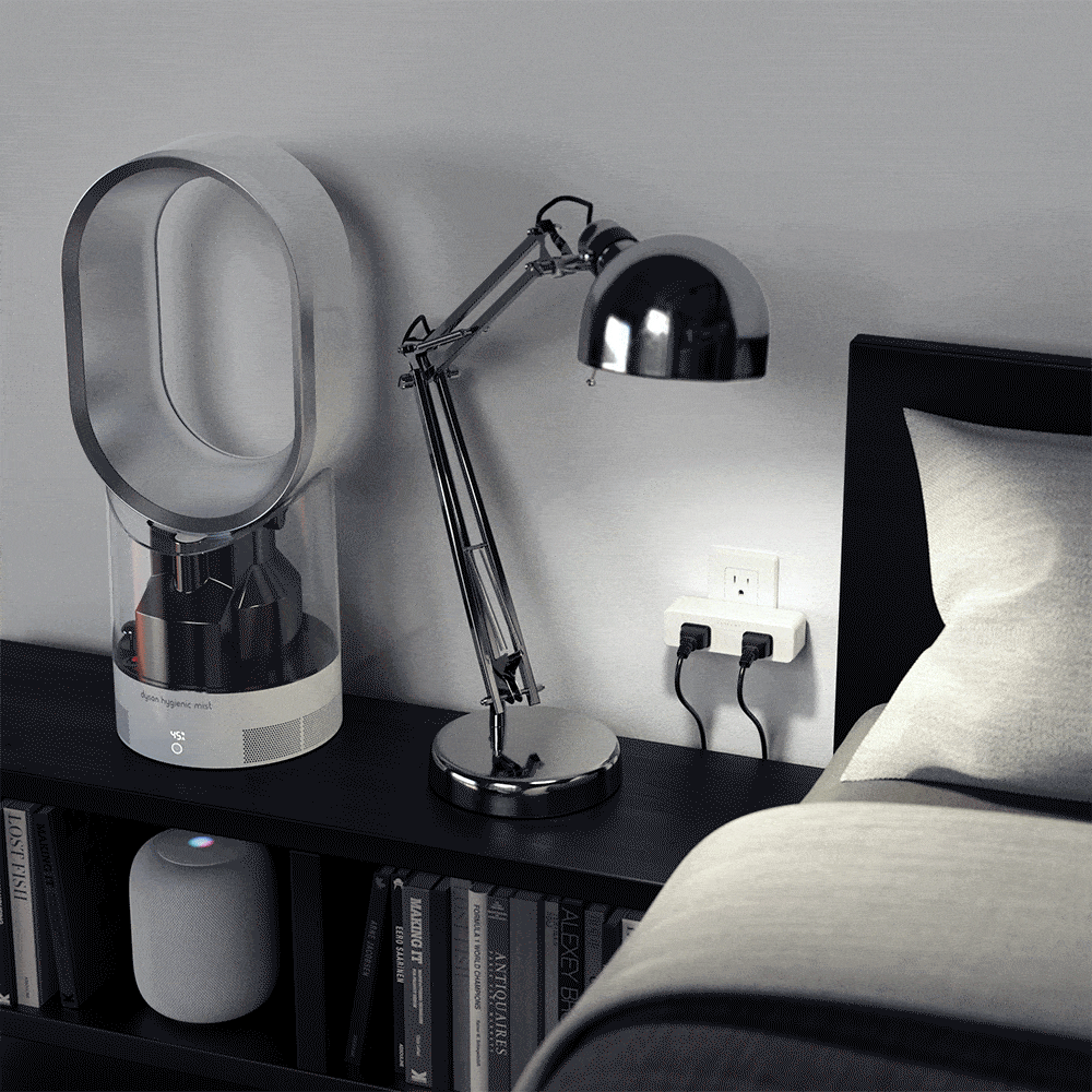 Dual Smart Outlet powering a lamp and fan on a bedside table