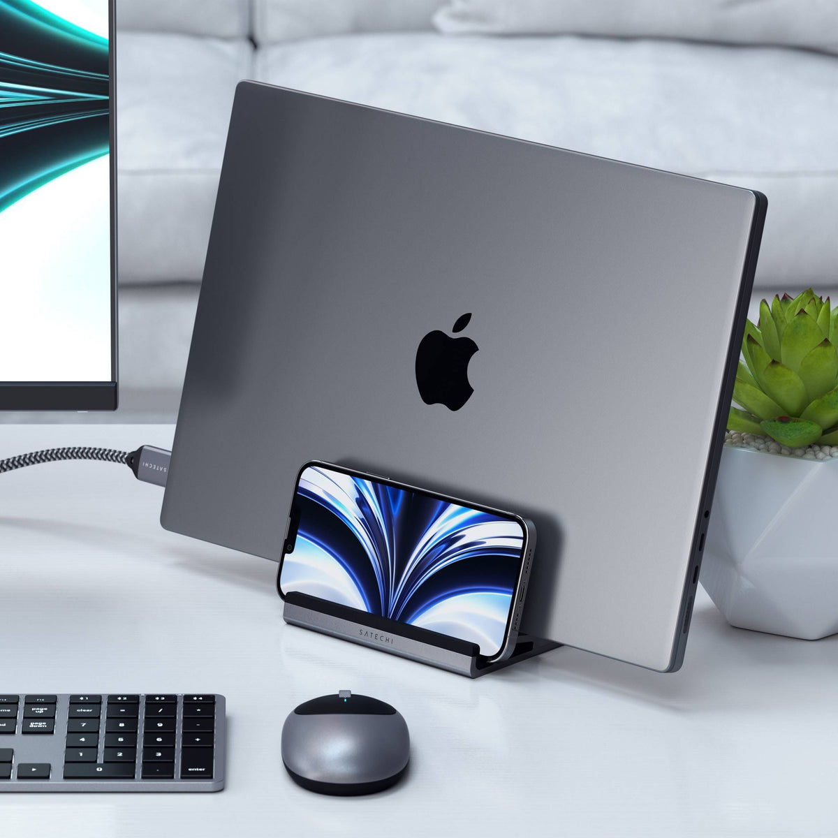 Dual Vertical Laptop Stand holding a MacBook and an iPhone on a desk with a keyboard, mouse and monitor