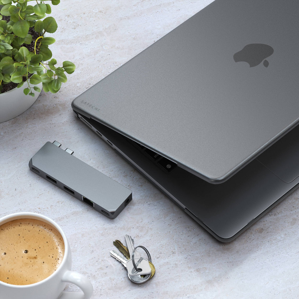 Eco-Hardshell Case for MacBook Air M2 in Dark on a MacBook Air next to a hub, keys and coffee
