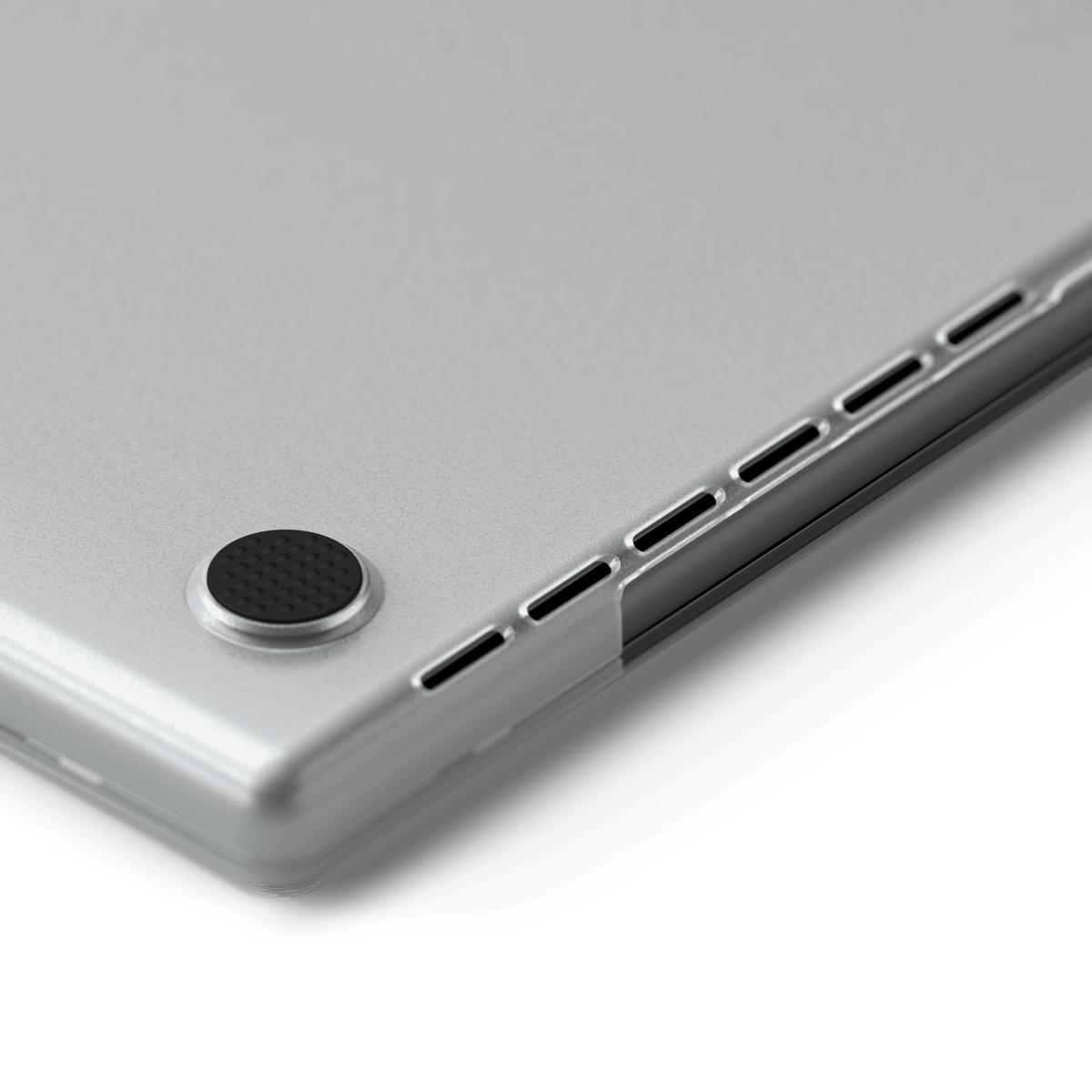 Eco-Hardshell Case for MacBook Pro 14-inch in Clear, close up of a rubber foot and vents