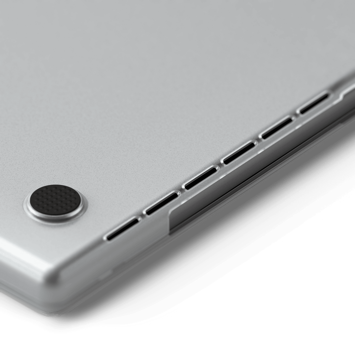 Eco-Hardshell Case for MacBook Pro 16-inch in Clear, close up of a rubber foot and vents