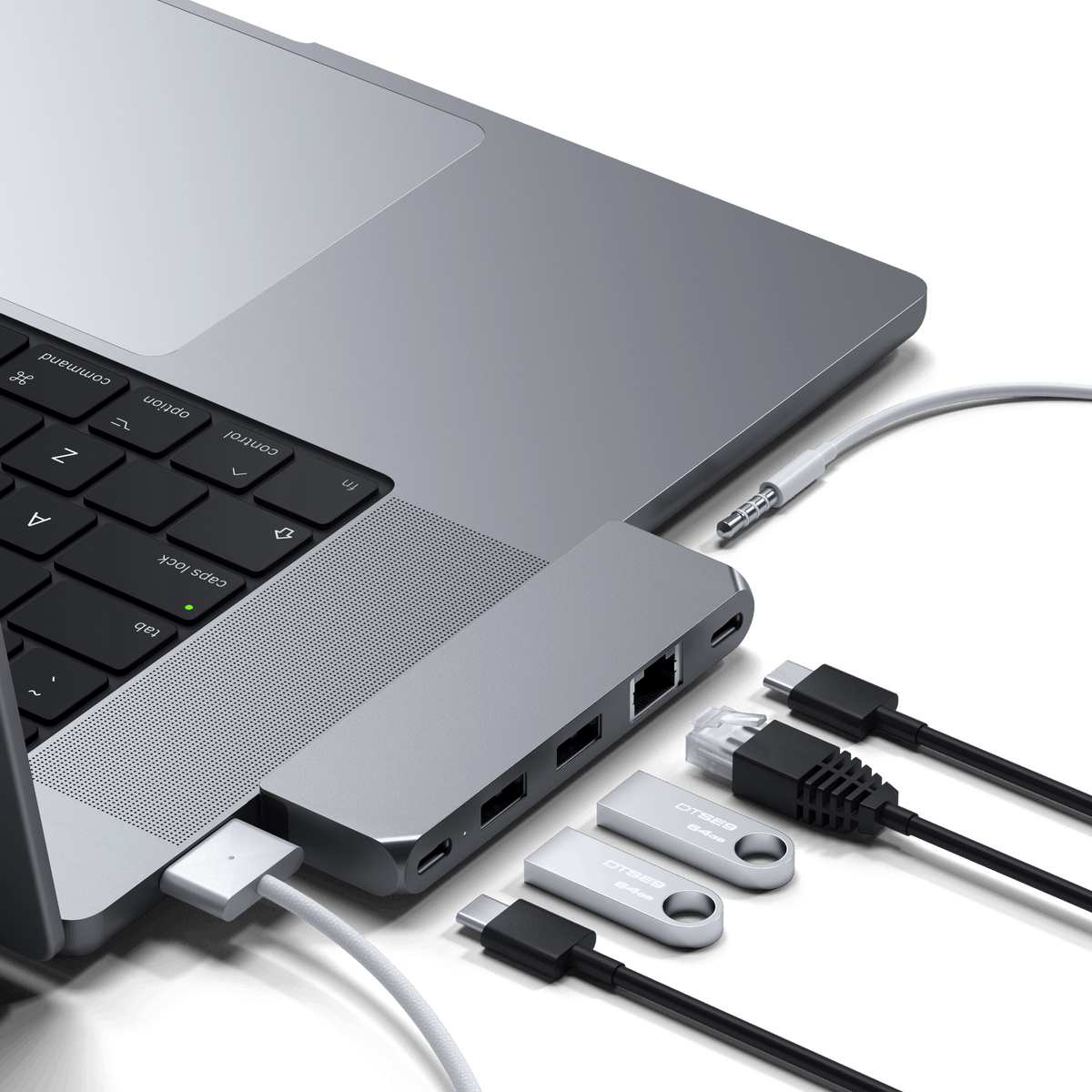 Pro Hub Mini in Space Gray plugged into the side of a MacBook Pro with cables connected