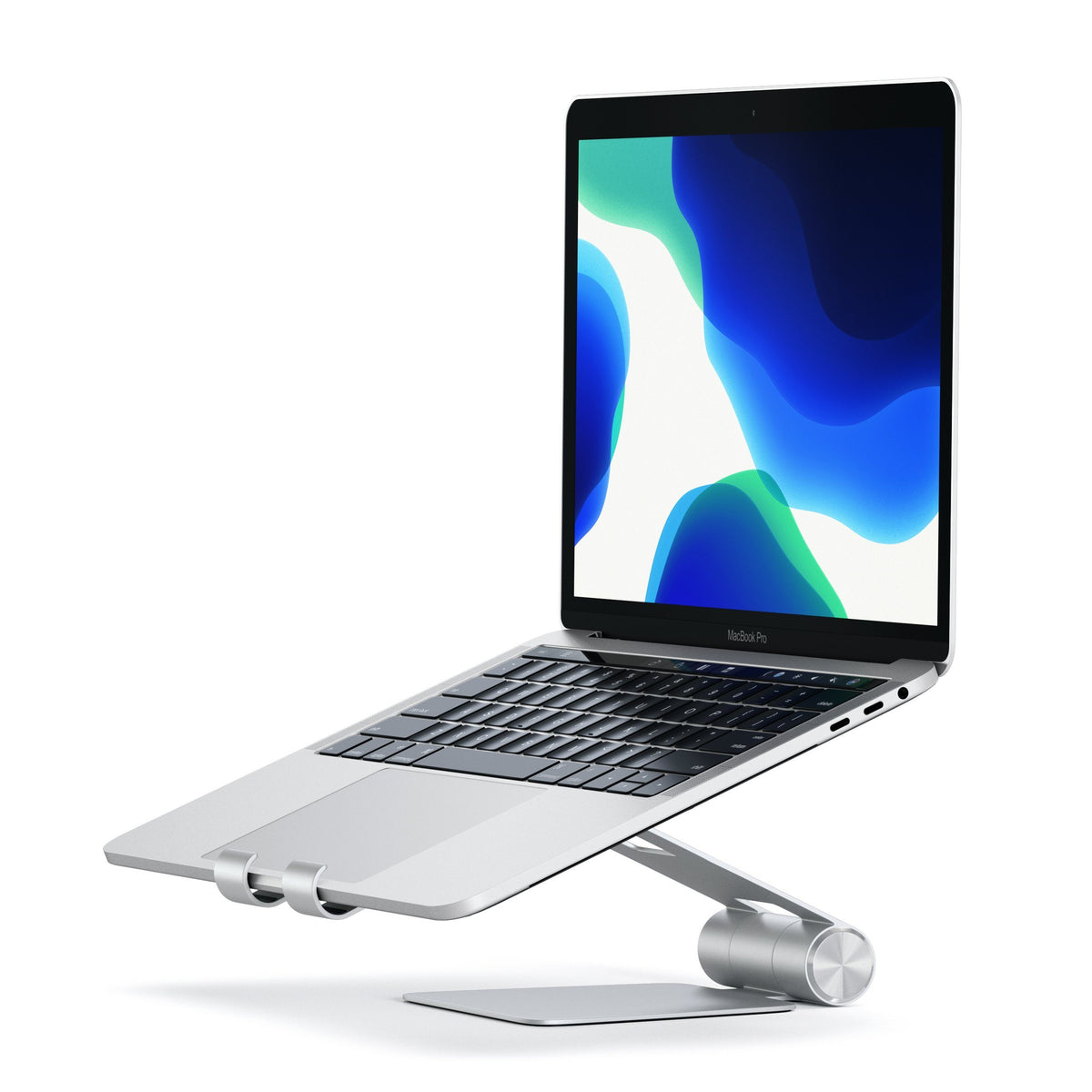 R1 Aluminum Hinge Holder Foldable Stand in Silver holding a MacBook