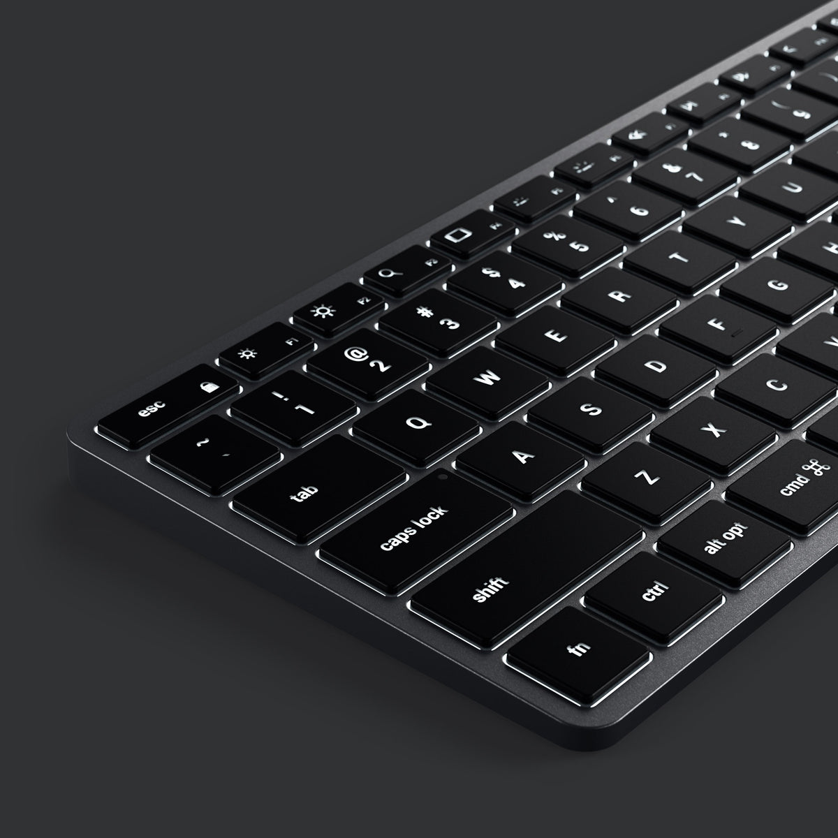 Slim X2 Bluetooth Backlit Keyboard in Space Gray, close up of backlit keys in the dark
