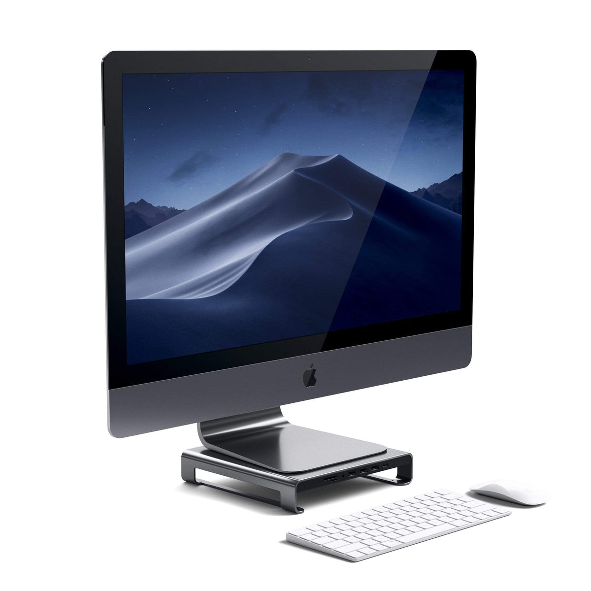 Type-C Aluminum Monitor Stand Hub for iMac in Space Gray under an iMac with keyboard and mouse, angled view