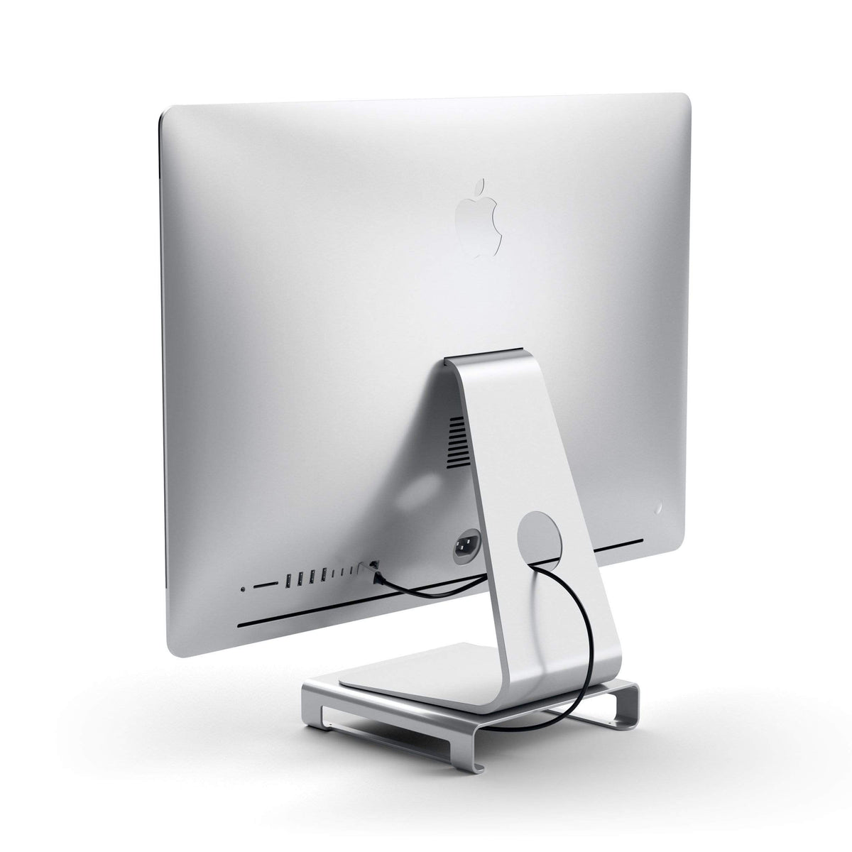 Type-C Aluminum Monitor Stand Hub for iMac in Silver under an iMac, back view with cable