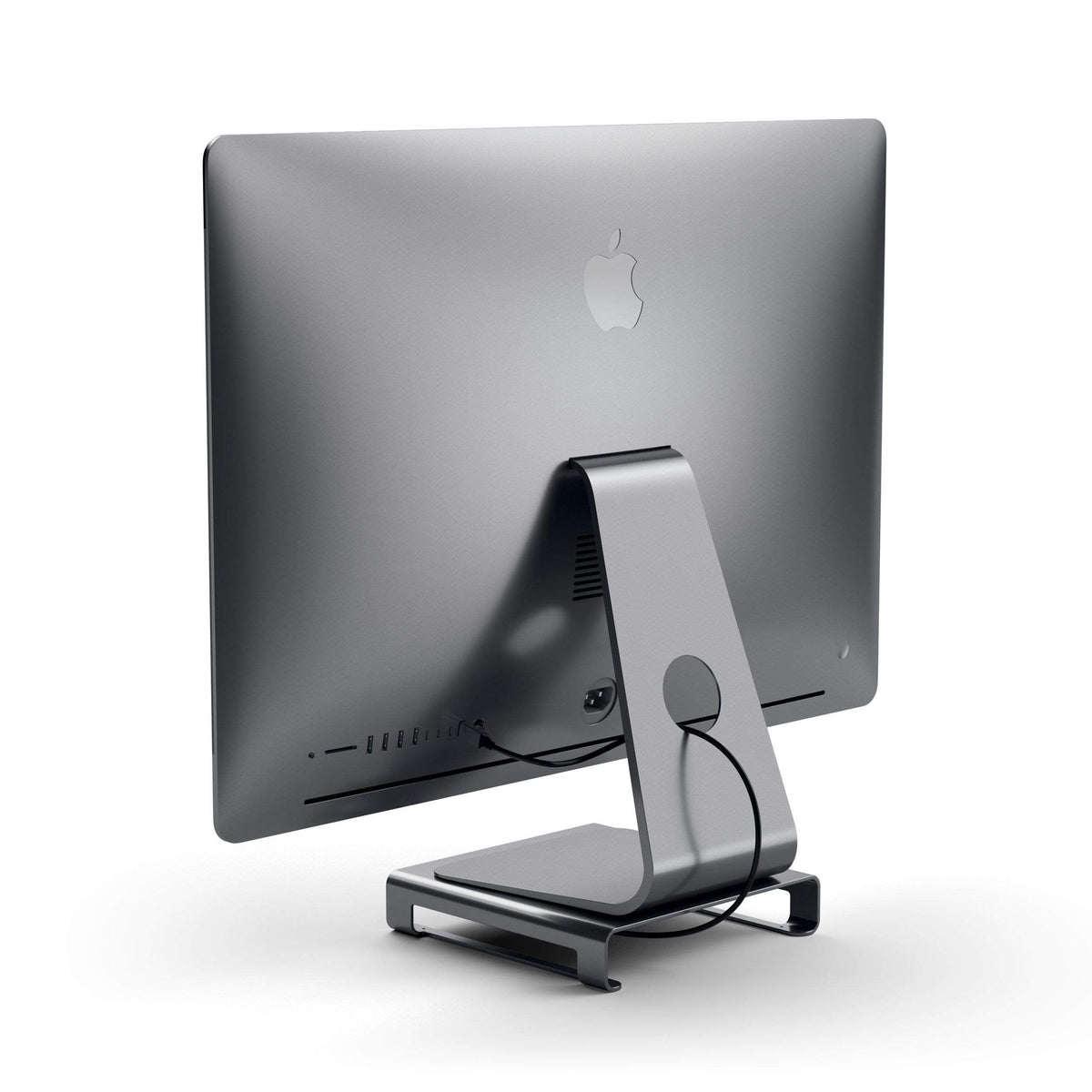 Type-C Aluminum Monitor Stand Hub for iMac in Space Gray under an iMac, back view with cable