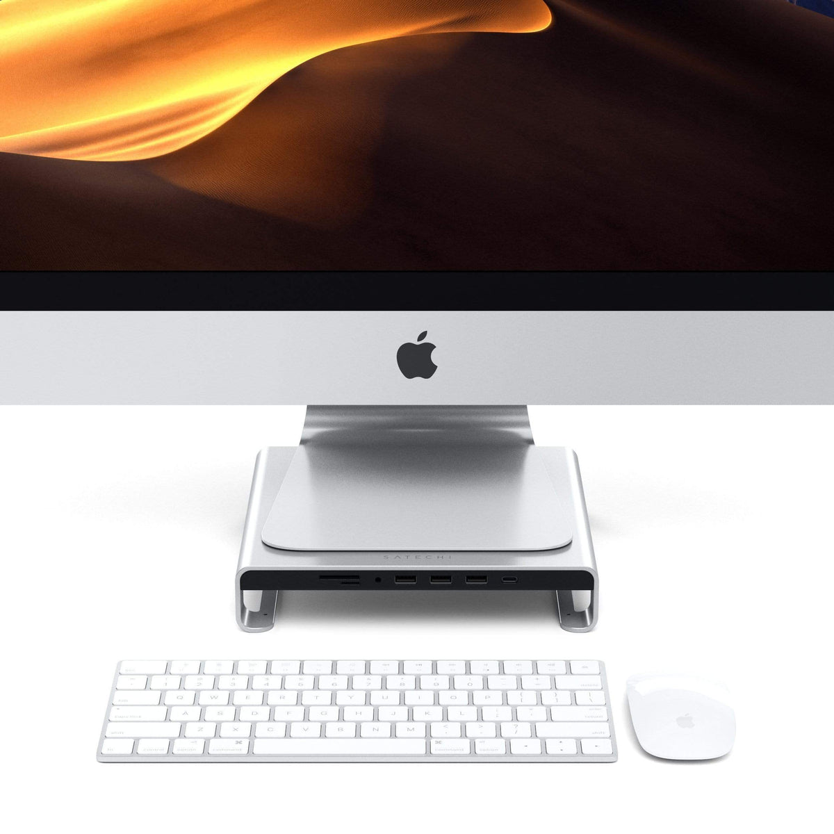 Type-C Aluminum Monitor Stand Hub for iMac in Silver under an iMac with keyboard and mouse, front view