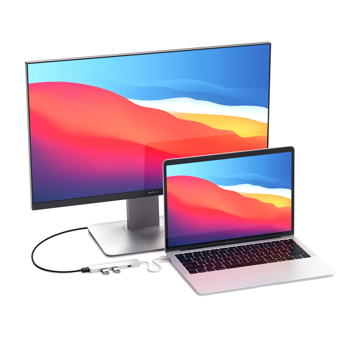 Type-C Slim Multi-Port Adapter 4K in Silver connecting a MacBook to an external monitor
