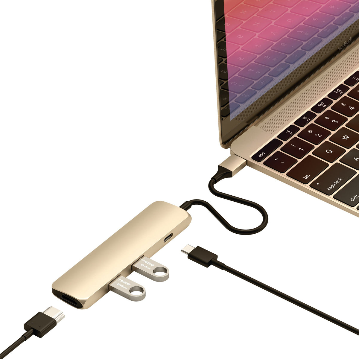 Type-C Slim Multi-Port Adapter 4K in Gold plugged into a MacBook with cables and flash drives