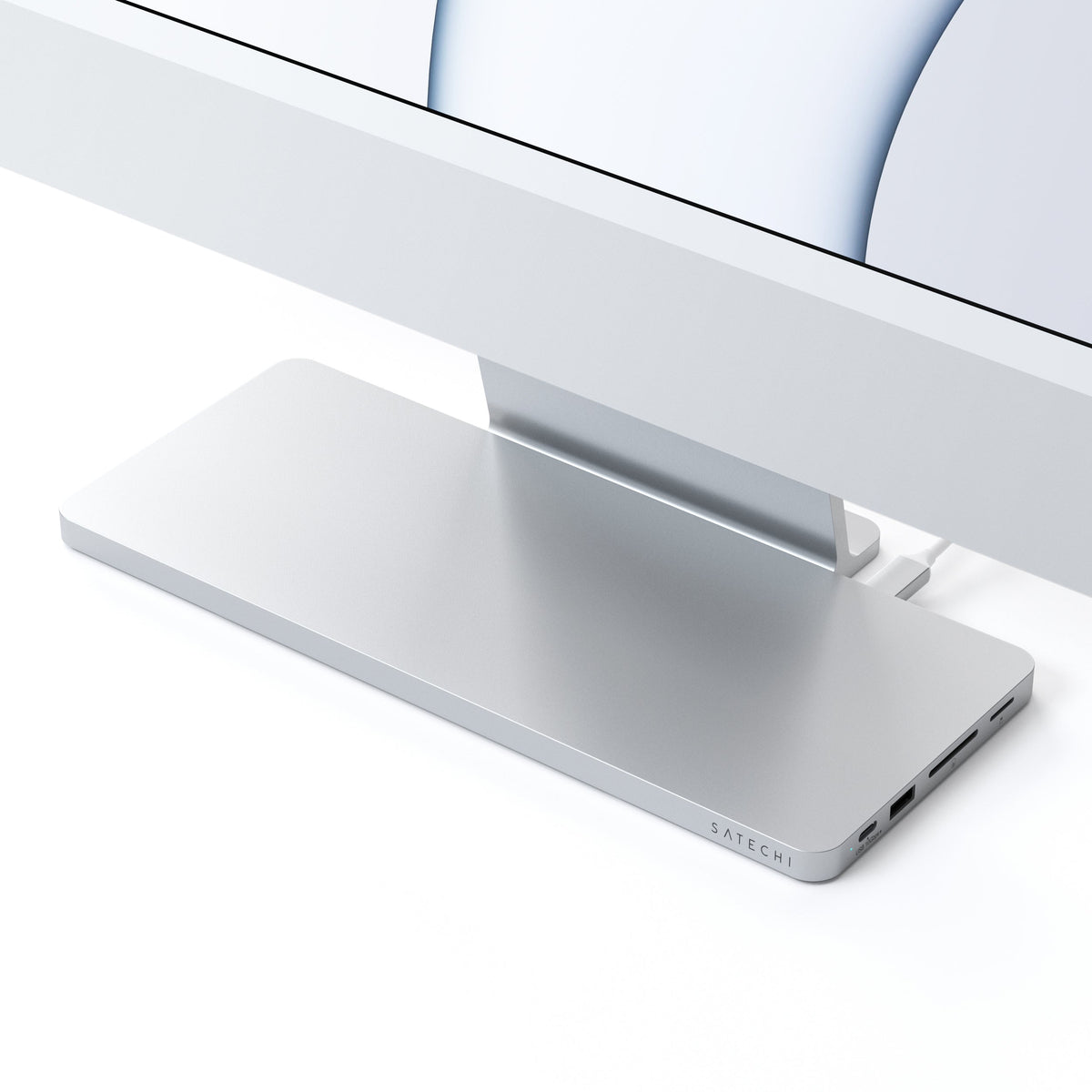 USB-C Slim Dock for 24" iMac in Silver under an iMac stand, close up of front ports
