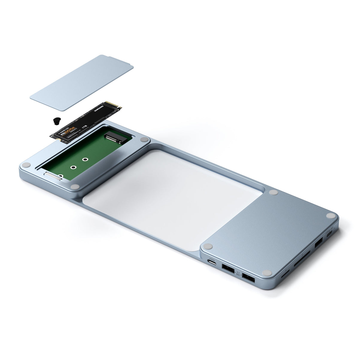 USB-C Slim Dock for 24" iMac in Blue with the SSD compartment open and an M.2 SSD being installed