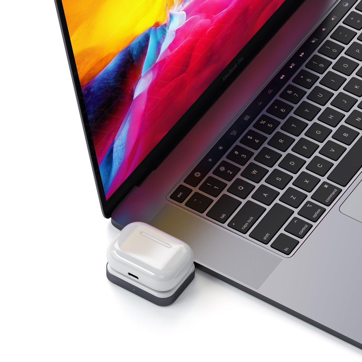 USB-C Wireless Charging Dock for AirPods plugged into a MacBook, charging an AirPods case
