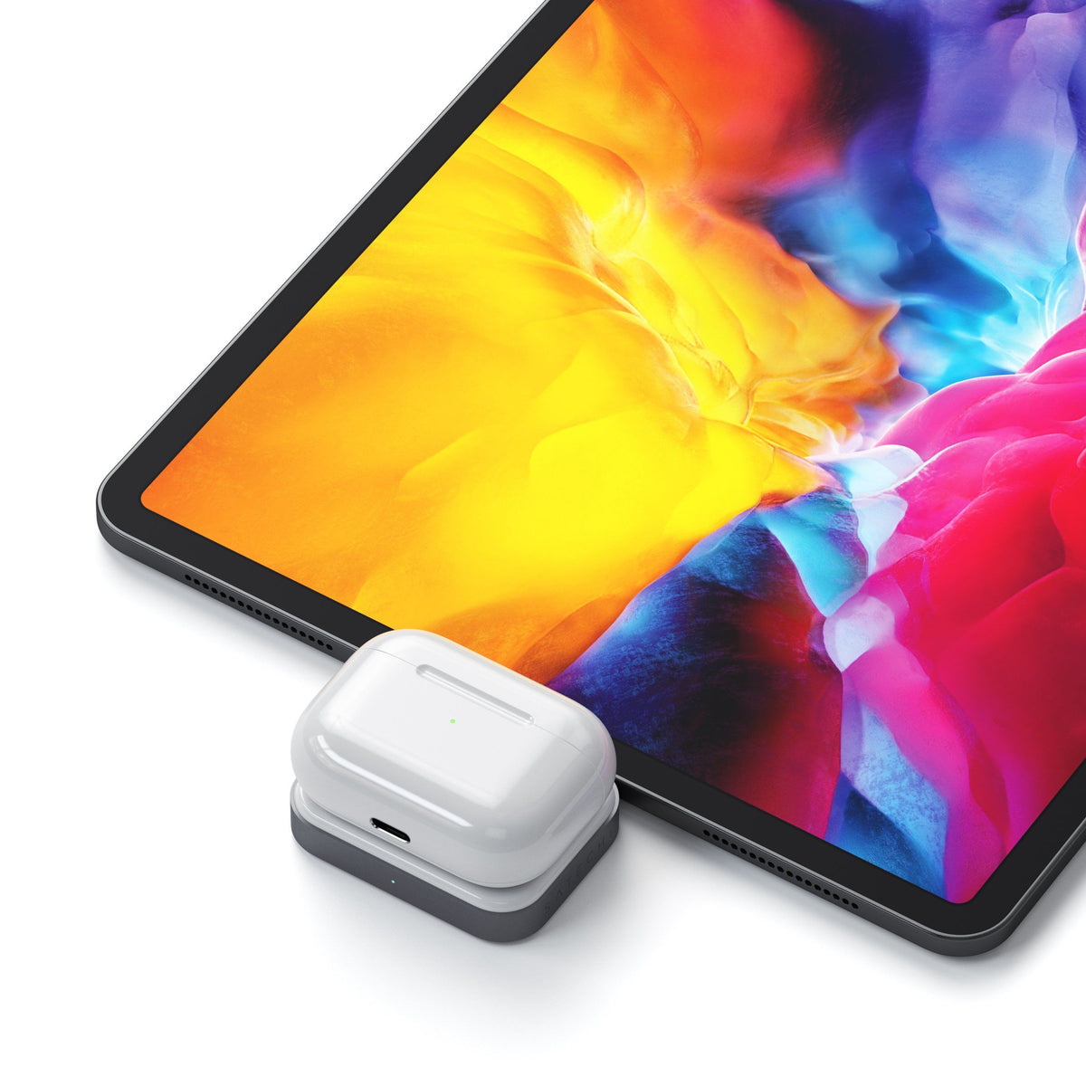 USB-C Wireless Charging Dock for AirPods plugged into an iPad Pro, charging an AirPods case