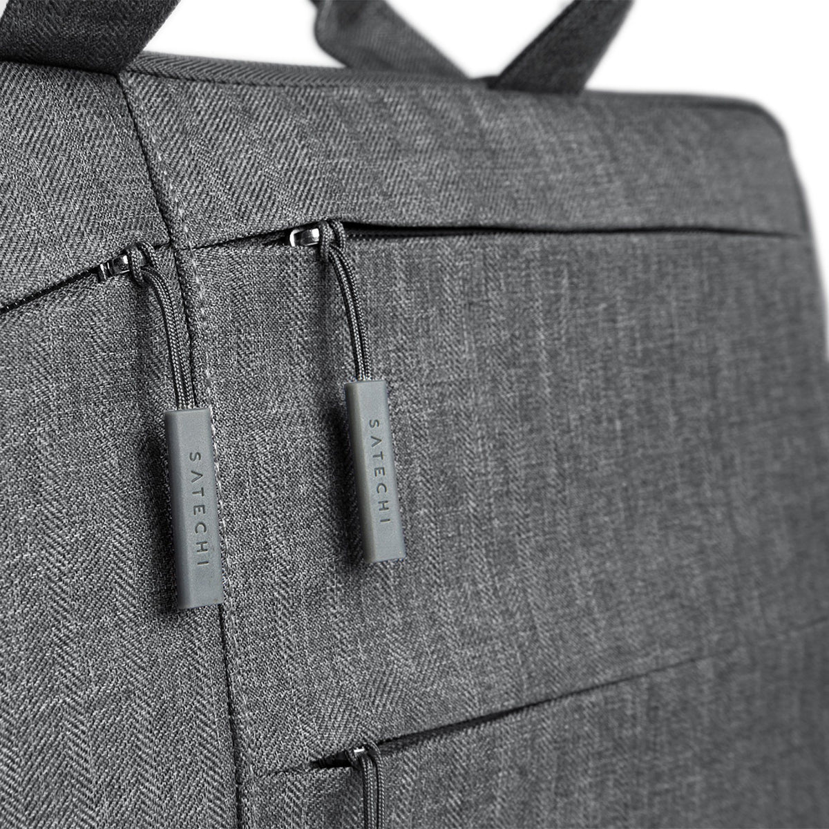 Water-Resistant Laptop Carrying Case with Pockets 15-inch, close up of zipper pulls and front pockets