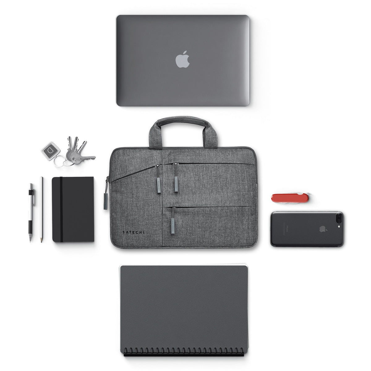 Water-Resistant Laptop Carrying Case with Pockets 15-inch with a laptop, notebook, keys and phone that fit inside