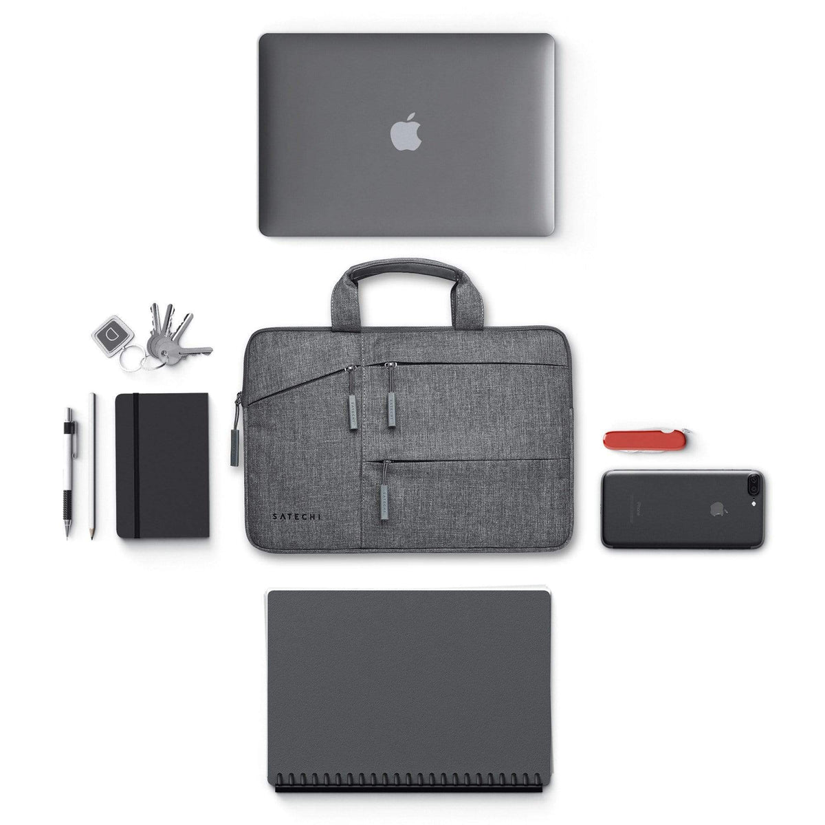 Water-Resistant Laptop Carrying Case with Pockets 13-inch with a laptop, notebook, keys and phone that fit inside