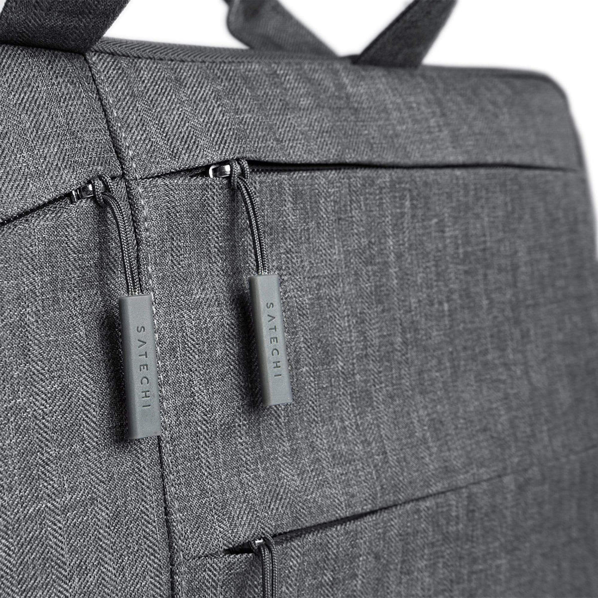 Water-Resistant Laptop Carrying Case with Pockets 13-inch, close up of zipper pulls and front pockets